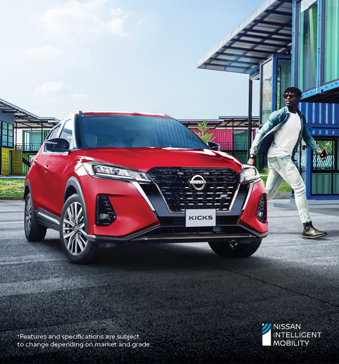 Red Kicks in front of home with man walking  away from it